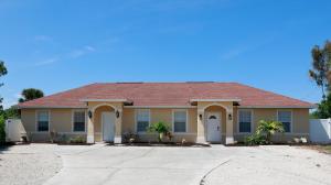 a large yellow house with a red roof at Stylish 2BR unit w/ hot tub 5 mins from the beach! in Bonita Springs +3 photos
