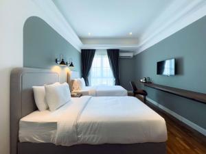 Postel nebo postele na pokoji v ubytování Hotel Seri Costa