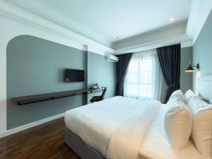 Postel nebo postele na pokoji v ubytování Hotel Seri Costa