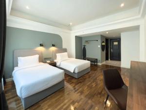 Postel nebo postele na pokoji v ubytování Hotel Seri Costa