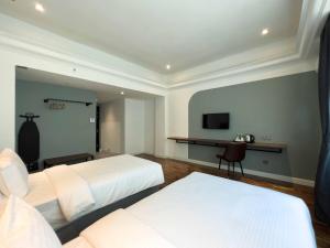 Postel nebo postele na pokoji v ubytování Hotel Seri Costa
