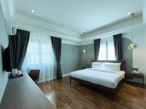 Postel nebo postele na pokoji v ubytování Hotel Seri Costa