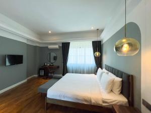 Postel nebo postele na pokoji v ubytování Hotel Seri Costa
