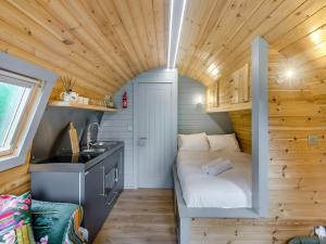 a small bedroom with a bed in a tiny house at Robin - Uk45516 in Humberstone