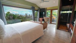 Ліжко або ліжка в номері CHiEM HoiAn - The Beachside Boutique Hotel & Villa