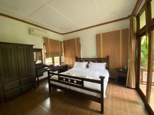 เตียงในห้องที่ ANANTAYA CHIANGMAI BOUTIQUE HOTEL