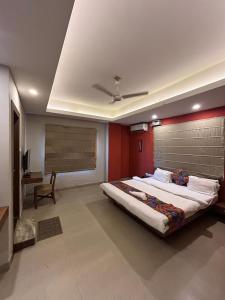 a bedroom with a large bed in a room at NirVana Lodge in Guwahati