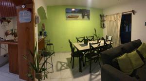 a living room with a table and a dining room at Cancun Ocean View KABIL Playa del Niño in Cancún