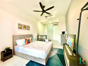 a bedroom with a bed and a ceiling fan at Sky Trees by Rentradise in Johor Bahru
