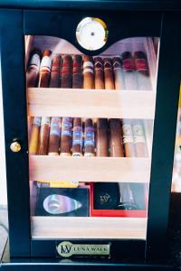 a box filled with lots of different types of cigars at Baan Sukreep Resort in Chaweng Noi Beach