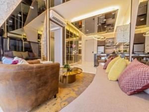a large living room with a couch and a table at Sky Trees by Rentradise in Johor Bahru