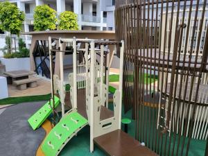 a playground with a slide in a park at Sky Trees by Rentradise in Johor Bahru