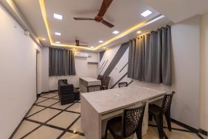 a conference room with a table and chairs at Fortune Inn in Erode