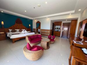 Ein Bett oder Betten in einem Zimmer der Unterkunft Aristocrat Residence & Hotel