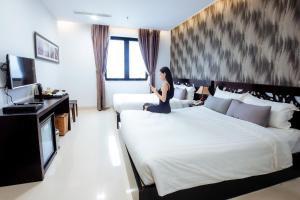 Postelja oz. postelje v sobi nastanitve Dylan Hotel Danang