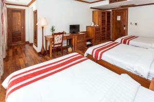 Postel nebo postele na pokoji v ubytování Cheathata CTA Hotel Siem Reap