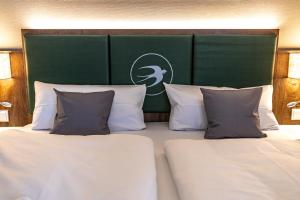 Ein Bett oder Betten in einem Zimmer der Unterkunft Pension Schwalbennest