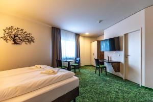 Ein Bett oder Betten in einem Zimmer der Unterkunft Pension Schwalbennest