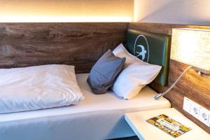 Ein Bett oder Betten in einem Zimmer der Unterkunft Pension Schwalbennest