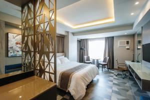 Ένα ή περισσότερα κρεβάτια σε δωμάτιο στο Zuri Hotel