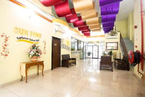 a lobby of a building with colorful ceiling at Sun Inns Hotel KopKastam Kelana Jaya in Petaling Jaya