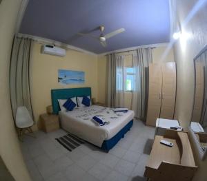 Letto o letti in una camera di Wind Breeze Sunset View Inn