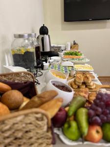 a table topped with lots of different types of food at Crown Hotel in Kutaisi