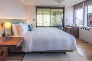 Ένα ή περισσότερα κρεβάτια σε δωμάτιο στο Kilin Hotel, JiaoXi