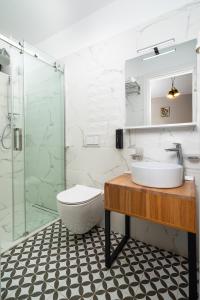 a bathroom with a sink and a shower at Labirint Boutique Hotel in Bucharest