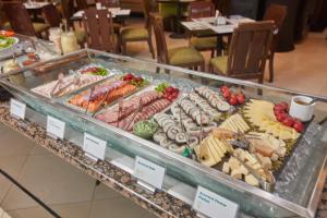 a display case filled with different types of food at Holiday Inn Manila Galleria, an IHG Hotel in Manila