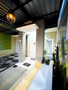 a lobby of a house with cactus at Homestay Kamar Tamu Sedayu in Bantul