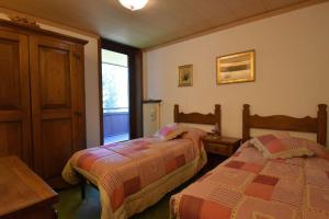 Кровать или кровати в номере Capanna Arnold Apartment