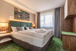 Ein Bett oder Betten in einem Zimmer der Unterkunft Pension Schwalbennest