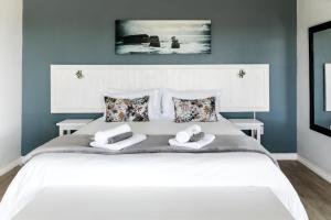 En eller flere senge i et værelse på Bona Vista Self-Catering Accommodation
