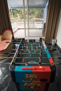 a table with a pool game on top of it at Nirvana Homestays in Siolim