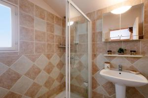 a bathroom with a sink and a shower at Villa la Farigoulo in Juan-les-Pins