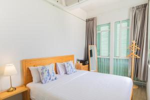 Postel nebo postele na pokoji v ubytování Latima Boutique Hostel