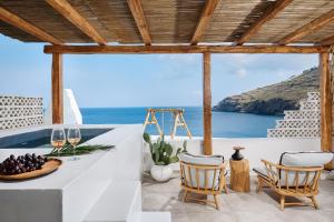 a dining room with a view of the ocean at Chrysalis Boutique - Adults Only in Astypalaia