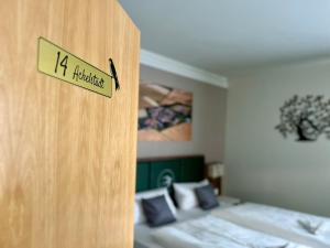 Ein Bett oder Betten in einem Zimmer der Unterkunft Pension Schwalbennest