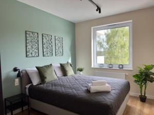 Posteľ alebo postele v izbe v ubytovaní Apartament Cobena