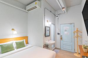 Postel nebo postele na pokoji v ubytování Latima Boutique Hostel