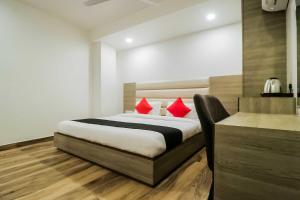 Ένα ή περισσότερα κρεβάτια σε δωμάτιο στο Hotel O Gn Pride