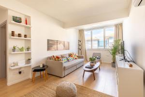 a living room with a couch and a table at City Center Apartment in Nicosia