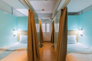 Postel nebo postele na pokoji v ubytování Latima Boutique Hostel