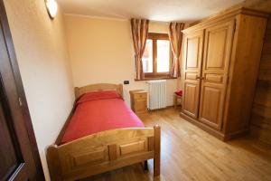 Giường trong phòng chung tại Maison Godioz - Appartamento 4