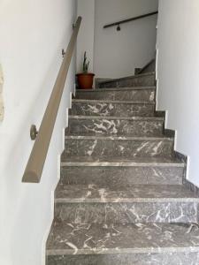a staircase with marble treads in a house at PLANTZOUNAKIS in Áno Viánnos