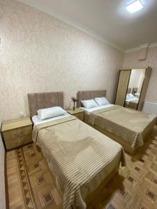 Postel nebo postele na pokoji v ubytování DARBAS GUEST HOUSE
