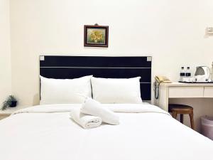 Letto o letti in una camera di Asphodel Inn