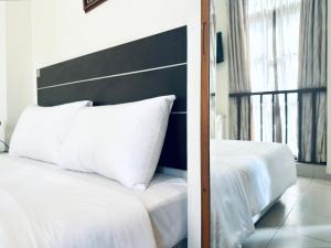 Letto o letti in una camera di Asphodel Inn