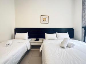 Letto o letti in una camera di Asphodel Inn